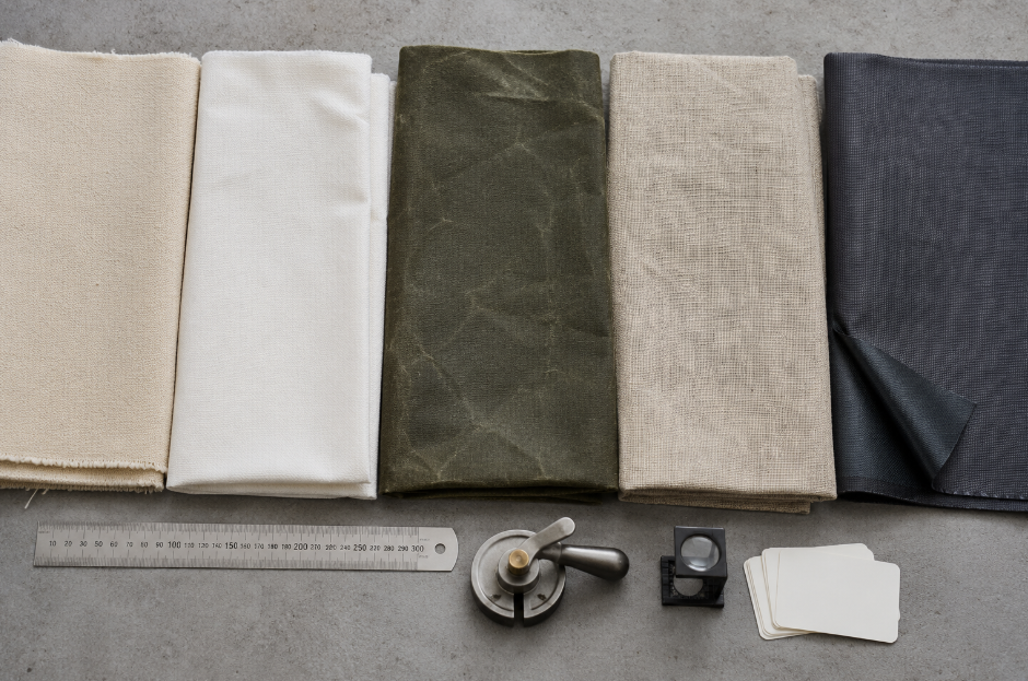 Cotton, linen, waxed, water-repellent, and coated polyester canvas samples compared by texture and finish